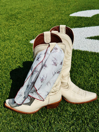 Bulldog chiffon scarf styled with Western boots outdoors