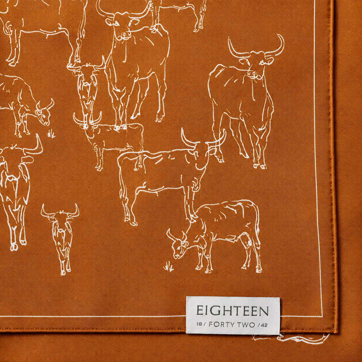 Burnt orange Texas Longhorn silk scarf styled for elevated game day fashion