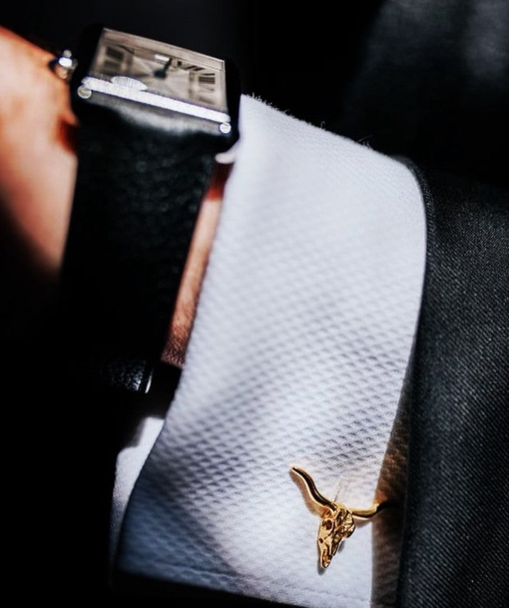 longhorn cufflinks worn on dress shirt
